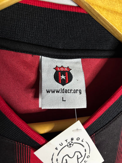 Etiquetas de la camiseta 2007 local de Liga Deportiva Alajuelense.