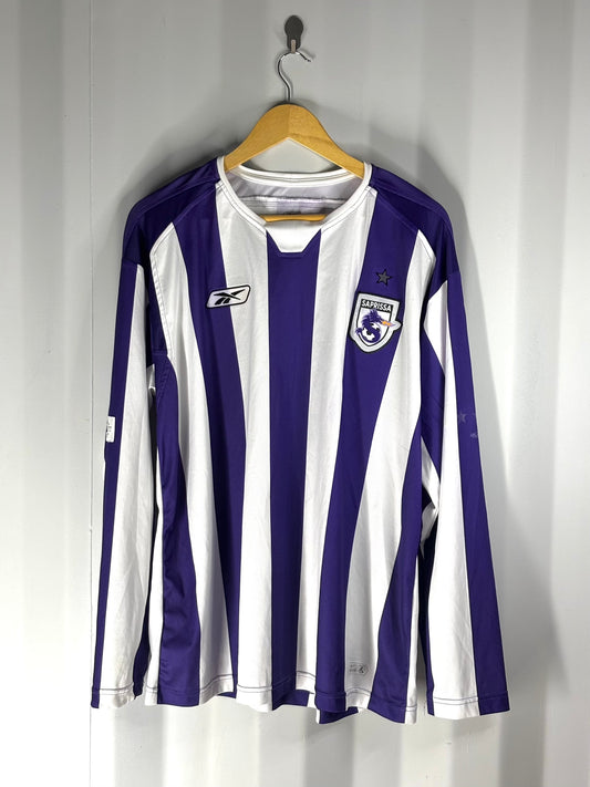 Camiseta de visitante del Deportivo Saprissa visitante en manga larga marca Reebok del año 2004.